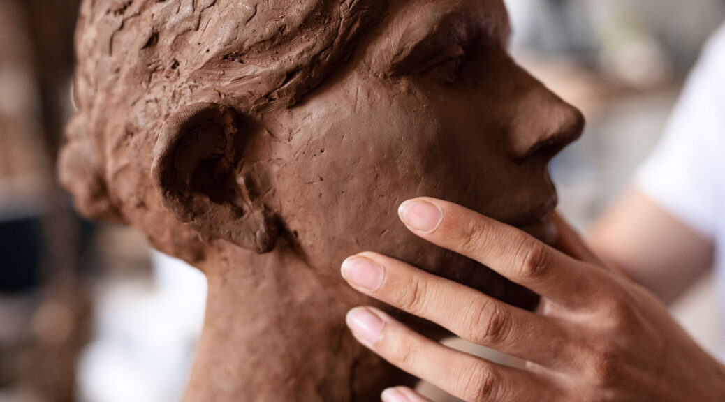 sided-view-hands-clay-sculpting-